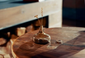 Two gold flowers in a glass vase, unique, alternative wedding rings