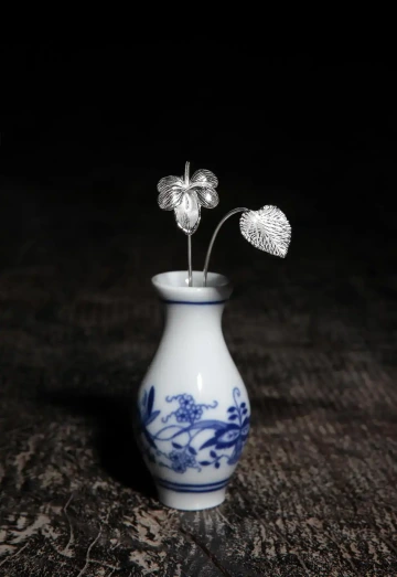 Violet with a leaf in silver for a corporate gift to employees