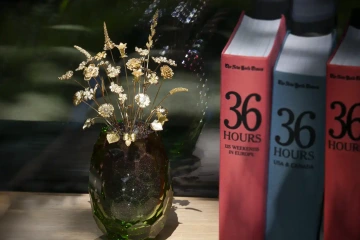 Gold bouquet of flowers in a Moser vase in library, unique birthday gift for man
