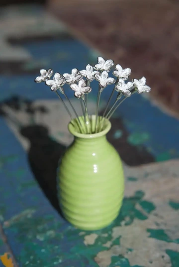 Bouquet of lilac in a green vase. A gift for bar and bat mitzvah.