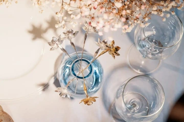 Festive table with gold daffodils in a vase