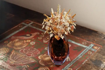 A large bouquet of golden flowers in a vase, luxury gift for wife