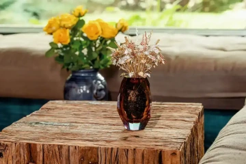 A large bouquet of golden flowers in a vase with yellow roses, a luxury gift for her