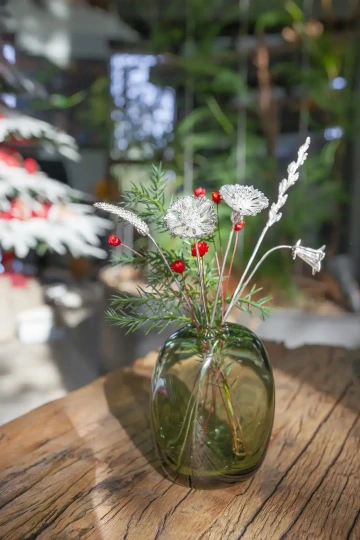Christmas decoration - Christmas bouquet with silver flowers in a glass vase