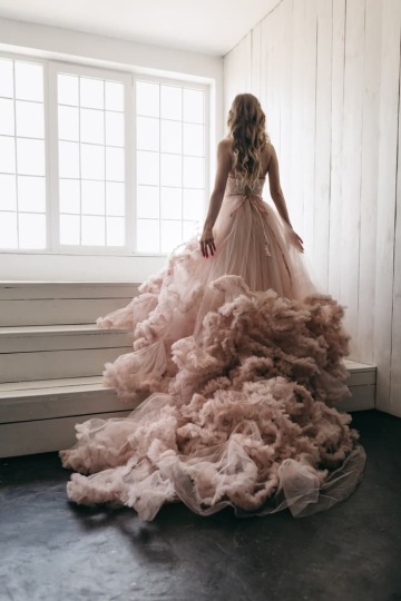 A woman with a beautiful dress from a fashion designer