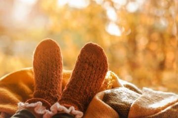 Man's feet with old, warm socks, ordinary gift