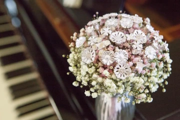 Festive bouquet of silver and white and pink flowers in a vase