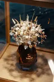 Vase with jewelery flowers on the wedding table, luxury wedding decoration